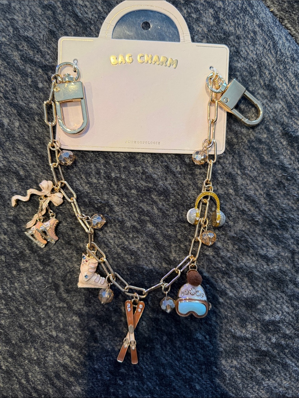 Anthropologie HERE COMES WINTER Gold-Tone Pink & Gold Ski Charm Bag Chain